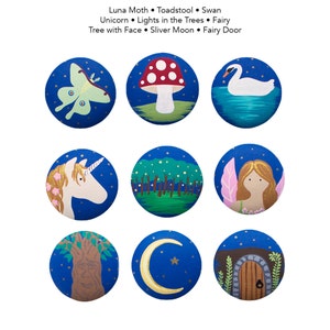 May include: Nine round blue painted stones with different whimsical designs. The designs include a luna moth, a toadstool, a swan, a unicorn, a forest with lights, a fairy, a tree with a face, a crescent moon, and a fairy door.