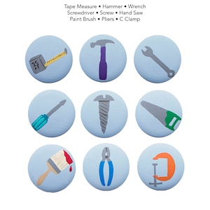 May include: Nine blue circular buttons with white outlines, each featuring a different hand tool illustration. The tools include a tape measure, hammer, wrench, screwdriver, screw, hand saw, paint brush, pliers, and a C clamp.