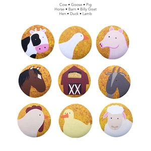 May include: Nine colourful illustrated circles featuring farm animals and a barn. The animals include a cow, pig, goose, horse, goat, hen, duck, and lamb. The barn is red with a brown roof and a bale of hay inside.
