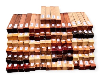 May include: A collection of small wooden blocks, each a different type of wood, stacked in a pyramid shape. The blocks are labeled with the type of wood.