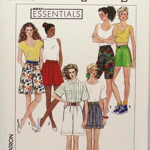 May include: Simplicity sewing pattern featuring various summer outfits. The pattern includes designs for skirts, shorts, and tops. The cover displays illustrations of the clothing items, with the text "easy ESSENTIALS" and "OVERLOCK/SERGER".