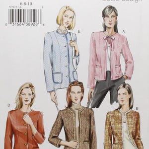 May include: Vogue basic design sewing pattern V7975. The pattern features illustrations of five different jacket styles. The jackets are in various colors, including pink, blue, and brown. The pattern size is 6-8-10.