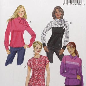 May include: A Butterick sewing pattern envelope featuring illustrations of four different blouses. The envelope is white with the text "B6419 Butterick" at the top. The illustrations show blouses in various colors and styles, including a pink blouse with a bow.