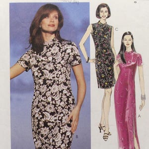 May include: A McCall's sewing pattern featuring three dress designs. The cover shows a woman in a black and white floral print dress. The pattern includes sizes 12, 14, and 16. The text "Easy McCall's" is at the top.