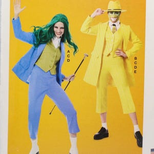 May include: McCall's costume pattern featuring two character designs. One design is a blue suit with a green wig, the other is a yellow suit with a mask. The pattern is labeled R11201, size R5 (14-16-18-20-22). Designed and printed in the USA.