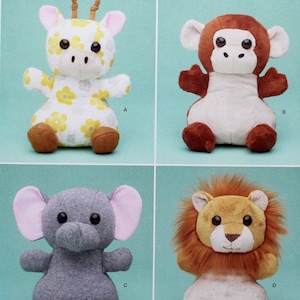 May include: A sewing pattern for four plush toys: a giraffe, a monkey, an elephant, and a lion. The pattern is from Simplicity and is for one size.