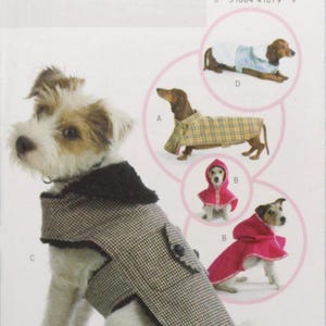 May include: A dog wearing a black and white patterned coat with a black collar. The image is a pattern for dog coats, with illustrations of dogs in various coat styles. The pattern is labeled "B4885 Butterick".