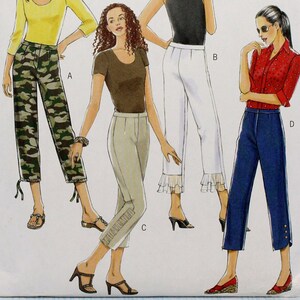 May include: A sewing pattern for four different styles of pants. The pattern is for sizes 6-8-10-12 and is from Butterick FAST & EASY. The pattern includes a pair of camouflage pants, a pair of white pants with lace trim, a pair of beige pants, and a pair of blue pants.
