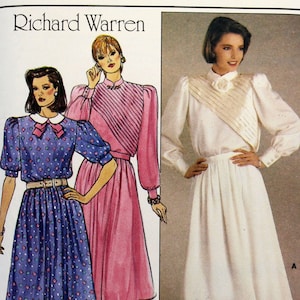 May include: A vintage sewing pattern for a dress, designed by Richard Warren for Butterick. The pattern number is 3160 and the size is 14. The pattern shows three different styles of dresses, one with a white top and skirt, one with a pink striped top and skirt, and one with a blue and white patterned top and skirt.