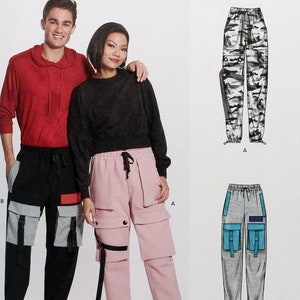 May include: Sewing pattern for two pairs of cargo pants. One pair is grey with blue accents, the other is pink. The pattern is from New Look and has the number N6745.