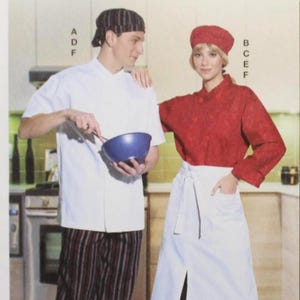 May include: McCall's sewing pattern M8332 featuring chef attire. The cover shows a man and woman in a kitchen setting, wearing chef coats, aprons, and hats. The pattern includes sizes A (S-M-L-XL-XXL). Designed and printed in the USA.