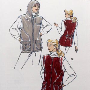 May include: A Kwik Sew sewing pattern, pattern number 2368, featuring illustrations of vests with pockets and a hooded vest. The pattern includes sizes XS-XL. The cover is white with black and red text.