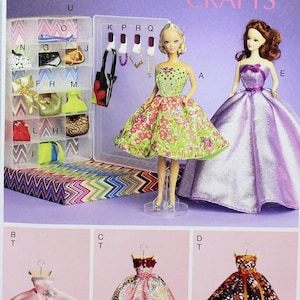 May include: A McCall's Crafts pattern sheet featuring doll designs. The sheet showcases two dolls wearing dresses, along with several dress designs. The text "McCall's Crafts" is displayed in pink. The sheet is designed and printed in the USA.