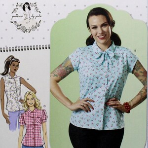 May include: A sewing pattern for a blouse with a bow tie. The pattern includes three different styles: a sleeveless blouse, a blouse with short sleeves and a blouse with puffed sleeves. The pattern is called "patterns by gurlie".
