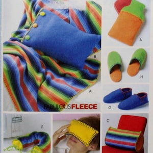 May include: A set of colorful fleece items, including a striped blanket, a pillow, a neck wrap, a sleep mask, and slippers. The items are all made of soft, cozy fleece and are perfect for staying warm and comfortable.