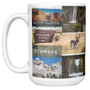 May include: White ceramic mug featuring a collage of South Dakota imagery. The design includes Mount Rushmore, waterfalls, a pronghorn, and the Badlands National Park sign. Text includes "Welcome to South Dakota" and "Sturgis."