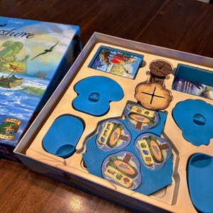 May include: A set of three ceramic mugs with a speckled, matte finish in cream, light grey, and dark grey. Each mug has a simple, minimalist design, suitable for coffee or tea.