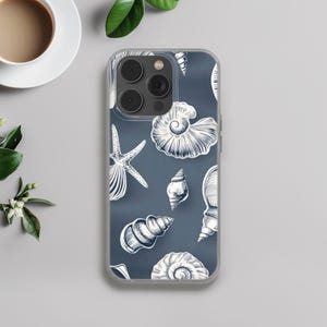 May include: A clear phone case with a blue background and a white seashell pattern. The case has a camera cutout and a clear back.