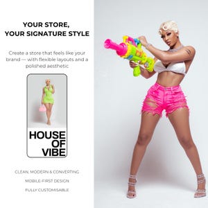 May include: A woman in a white top and pink distressed shorts holds a neon green and pink water gun, water spraying. The image includes text: "YOUR STORE, YOUR SIGNATURE STYLE" and "HOUSE OF VIBE". The text also says "CLEAN, MODERN & CONVERTING, MOBILE-FIRST DESIGN, FULLY CUSTOMISABLE."
