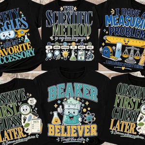 May include: A collection of six black t-shirts featuring science-themed graphics and text. Designs include phrases like Safety Goggles Are My Favorite Accessory, The Scientific Method, I Have A Measuring Problem, and Observe First Guess Later.