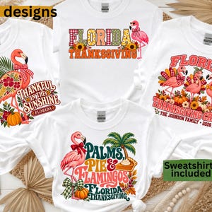 May include: Four white t-shirts featuring graphic designs of pink flamingos, pumpkins, sunflowers, and autumn foliage. The text includes "Florida Thanksgiving," "Thankful in the Sunshine," "Florida Thanksgiving Crew The Johnson Family 2026," and "Palms, Pie & Flamingos."