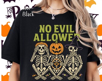 May include: Black t-shirt with the text "NO EVIL ALLOWED" above three skeleton figures. The skeletons are in the "see no evil, hear no evil, speak no evil" poses, with pumpkin and witch hat details. Halloween themed.