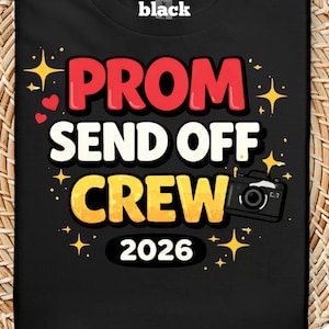 May include: Black t-shirt with the words "PROM SEND OFF CREW 2026" in red, white, and yellow. The design includes a camera graphic and star accents. The word "black" is at the top.