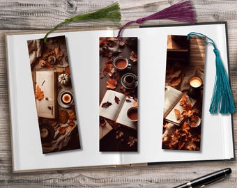 May include: Three bookmarks with fall-themed designs featuring books, coffee cups, and autumn leaves. The bookmarks are made of paper and have a tassel.