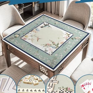May include: Wooden square table with a floral design and the text "Wide Range of Uses". The table is surrounded by chairs. The image shows the table can be used for playing cards, mahjong, and dominoes.