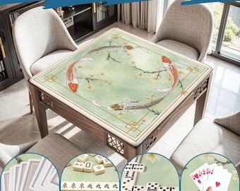 May include: Wooden square table with a green top featuring koi fish and floral designs. The table is surrounded by chairs and has a decorative border. The image also shows playing cards, dominoes, and mahjong tiles.