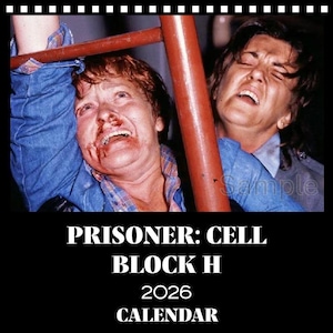 May include: A calendar featuring a dramatic scene from the series "Prisoner: Cell Block H." The image shows two women in distress, with one appearing injured. The calendar's title and year, "2026," are displayed in bold white text.