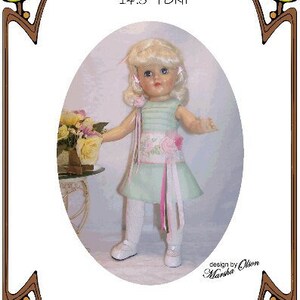 May include: A doll wearing a light green dress with a pink sash and white tights. The doll is standing on a white surface with a floral arrangement in the background. The image includes the text "Style 198", "14.5" TONI", "design by Olson Marsha", "Tea at Grandma's", "Perfect Patterns for Fashion Dolls 1999-2019".