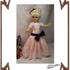 May include: A pink dress with a black velvet sash and white lace trim for a 14.5 inch doll. The dress is called "The Recital" and is a pattern by Marsha Olson for Perfect Patterns.