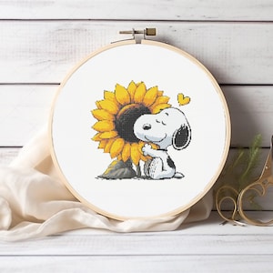 May include: Snoopy, the beloved beagle from Peanuts, is hugging a large yellow sunflower with a brown stem. A small red heart is above Snoopy's head.