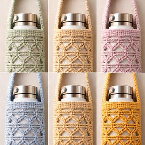 May include: A collection of six water bottle carriers in various colors, including green, beige, pink, blue, light brown, and yellow. Each carrier is made of crocheted yarn with a geometric pattern and a strap for carrying. The bottles have a silver lid.