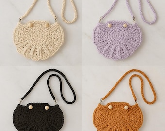 Puede incluir: Cuatro bolsos de ganchillo en crema, lavanda, negro y naranja. Cada bolso tiene una forma redonda, similar a una concha, con una correa trenzada y cierre de botón de madera. El texto "CROCHET BAGS" está en la parte inferior.
