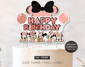 May include: Pink and black cake topper featuring a cartoon image of Minnie Mouse with a bow and five baby Minnie Mouse characters. The topper says "Happy Birthday".