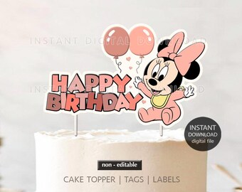 May include: A cake topper featuring Minnie Mouse with a pink bow, holding out her arms. The words "Happy Birthday" are displayed in pink and red. Two pink balloons and the text "Instant Download digital file" are also visible.