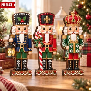 May include: Three decorative nutcracker figurines standing on a wooden surface. The left figure holds a lantern, the centre figure holds a candy cane, and the right figure holds a green gift box. Each wears a uniform with detailed trim and a hat.
