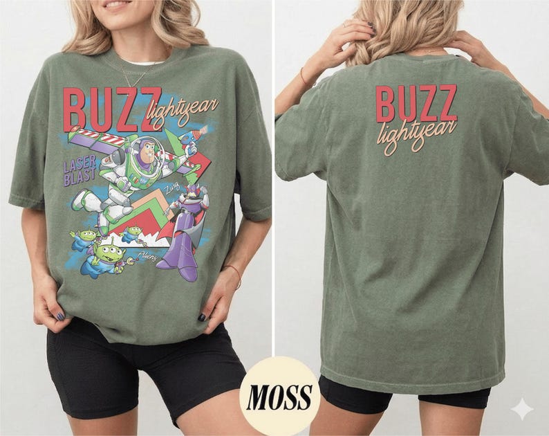 May include: Olive green t-shirt featuring a graphic of Buzz Lightyear and other characters from the movie. The front of the shirt has the words "BUZZ lightyear" in red and yellow. The back of the shirt also has the words "BUZZ lightyear".