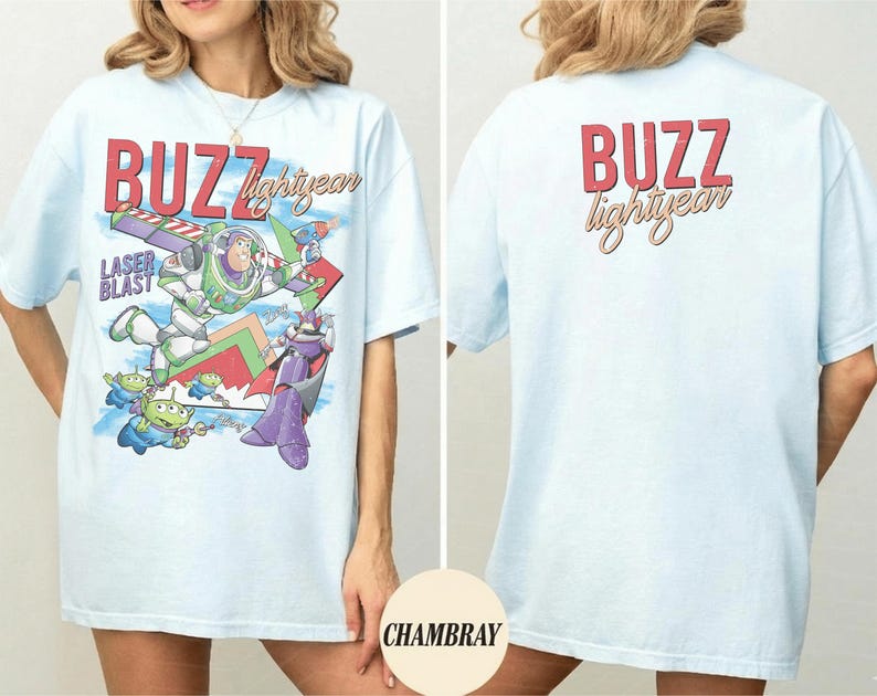 May include: Light blue t-shirt featuring a graphic of Buzz Lightyear with the text "BUZZ lightyear" in red and yellow. The front of the shirt shows Buzz in action with the words "LASER BLAST". The back of the shirt has the text "BUZZ lightyear".