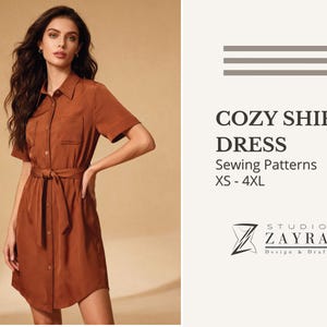 May include: A rust-colored shirt dress with short sleeves, a button-down front, and a tie belt. The dress has two chest pockets and is labeled "COZY SHIRT DRESS" with sewing pattern sizes XS-4XL. The Studio Zayra logo is also visible.
