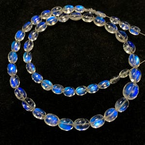 Rainbow Moonstone Briolette Beads: Smooth Oval Blue Fire (51 pcs, 4x5 - 6x9 mm)