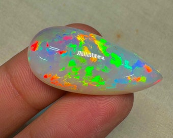 OPAL Welo Ethiopian - Rare Unique Pcs Best Quality -  Full Flash Galaxy Pin Fire - Pear  Shape Cabochon  Size - 16x34 mm Height- 10