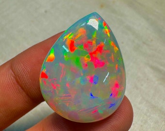 OPAL Welo Ethiopian - Rare Unique Pcs Best Quality -  Full Flash Galaxy Pin Fire - Pear  Shape Cabochon  Size - 22x28  mm Height-9