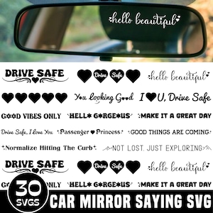 May include: A collection of black vinyl decals featuring various phrases and heart icons for car rearview mirrors. Text includes Drive Safe, hello beautiful, You looking Good, I heart U, Drive Safe, GOOD VIBES ONLY, HELLO GORGEOUS, and MAKE IT A GREAT DAY.