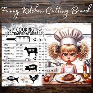May include: A rectangular cutting board featuring a cooking temperature chart for beef, pork, fish, and poultry with Fahrenheit and Celsius scales. An illustration of a chef with blonde pigtails and a white hat stands next to a plate with a steak.