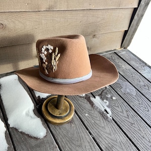 Custom made Cowboy Hat with hand burned flower design on brim and leather hat band