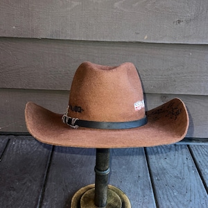 Custom made Cowboy Hat with hand burned flower design on brim and leather hat band