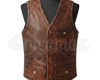 May include: A brown distressed leather vest featuring a V-neckline, a front button closure, two large lower pockets with buttoned flaps, and a single smaller chest pocket with a buttoned flap. The word Onicamax is visible across the center.